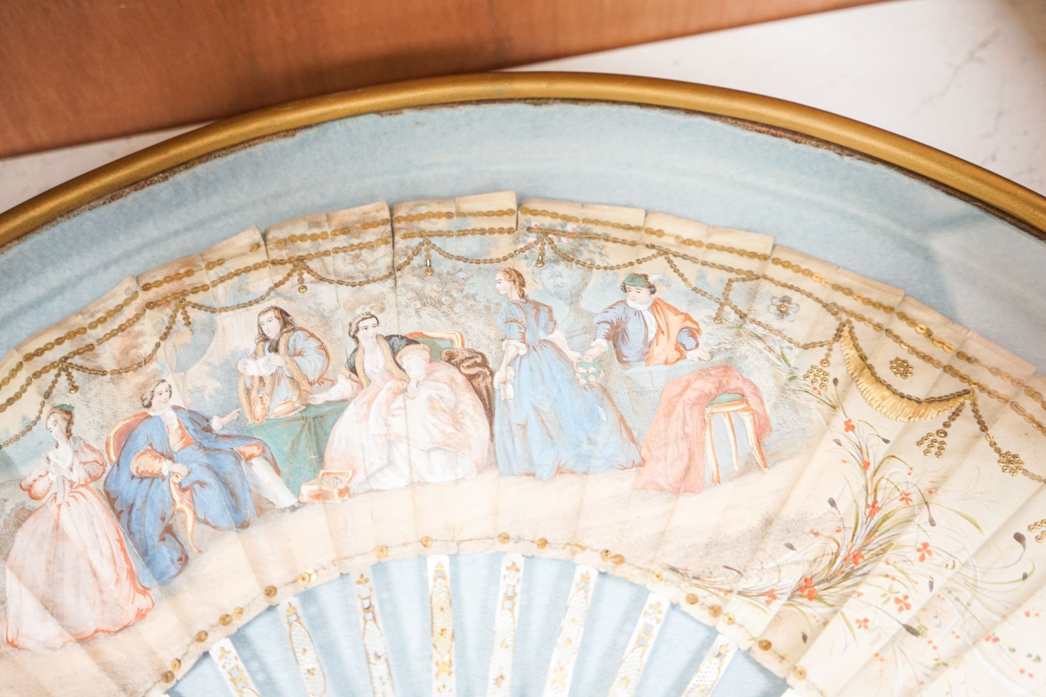 A late 18th / early 19th century Continental figurative framed fan and two religious cased effigy of baby Jesus